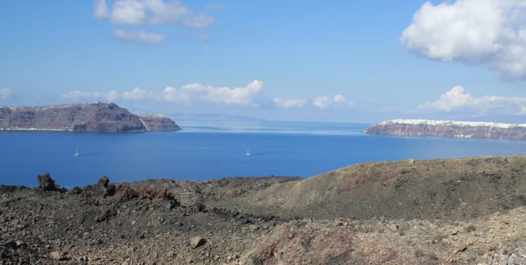 View, looking North, of the northern part of the Santorini caldera. The island of Thersia (left) is separated from the island of Thera (right) by a channel, that is now thought to have formed at the end of the Late Bronze Age eruption.