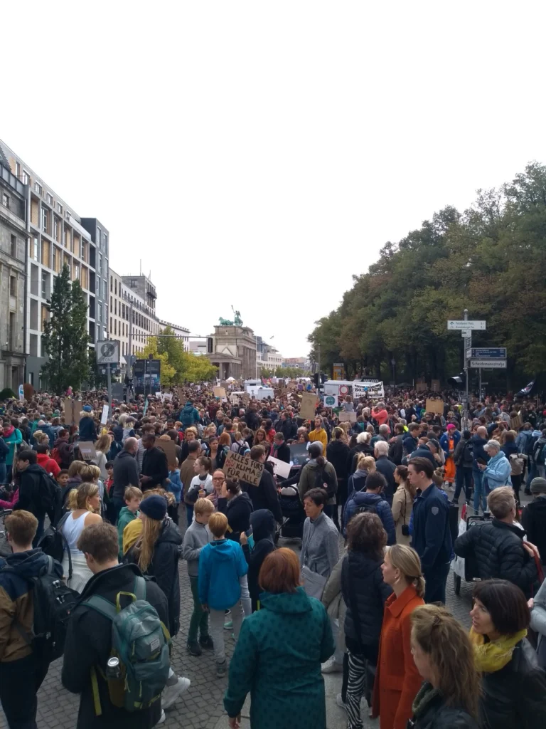 Protestors on their way to the Brandenburg Gate in Berlin.
