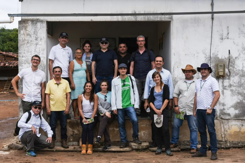 A group of people in front of an house entrance.
